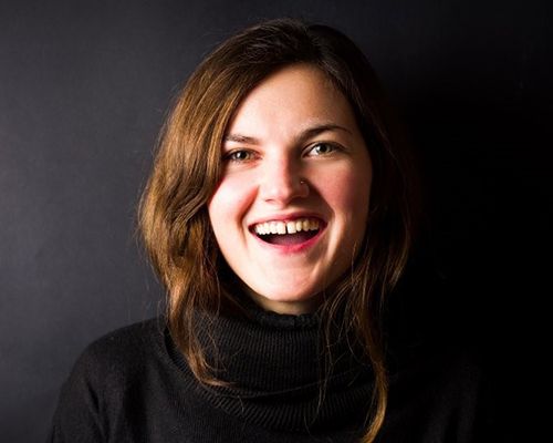 woman with gap in two front teeth smiling