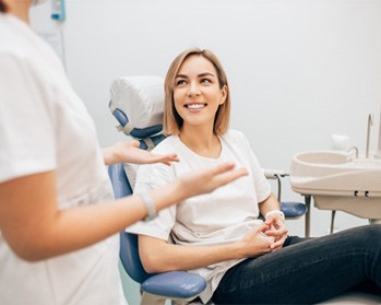 Blue piggy bank on top of dentures in Center