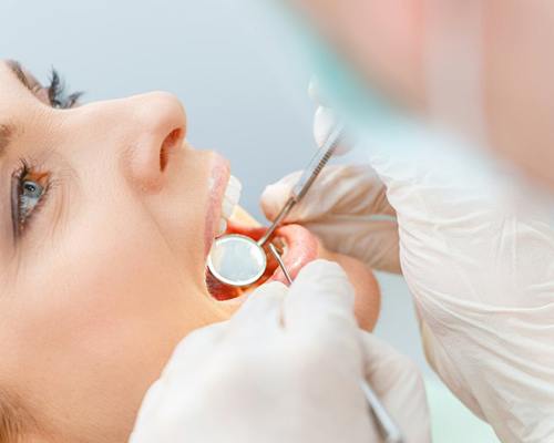 Woman receiving dental bridges in Center