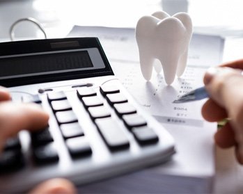 A patient calculating the cost of root canal therapy