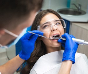 A woman receiving root canal therapy