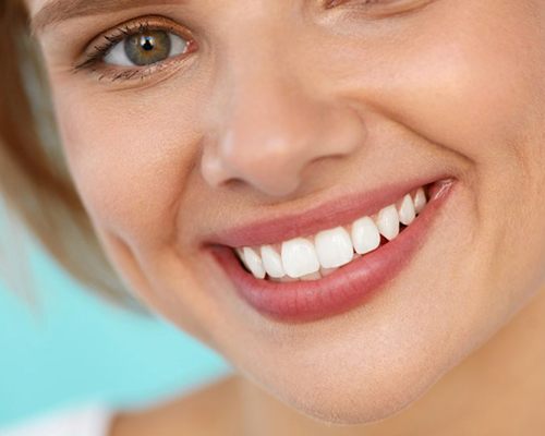 Woman with beautiful, healthy smile after visiting Center dentist