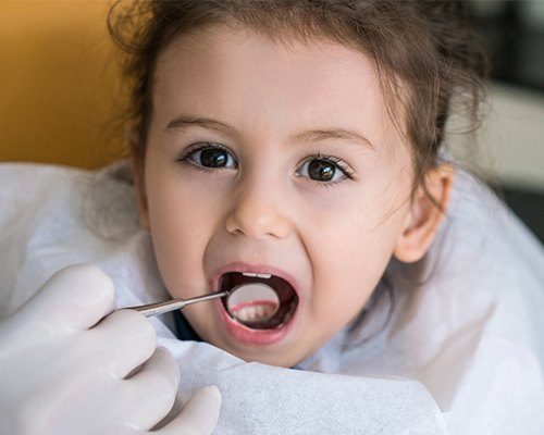 Child receiving dental exam