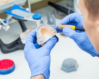 Lab technician making dentures