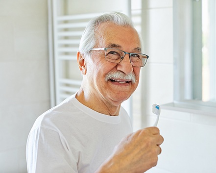 Dentures patient in Center smiling