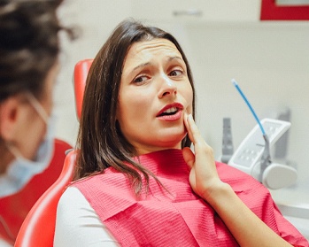 Woman at dentist for tooth extractions in Center