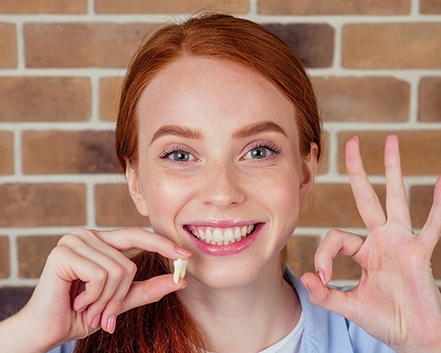 Girl after tooth extraction in Center