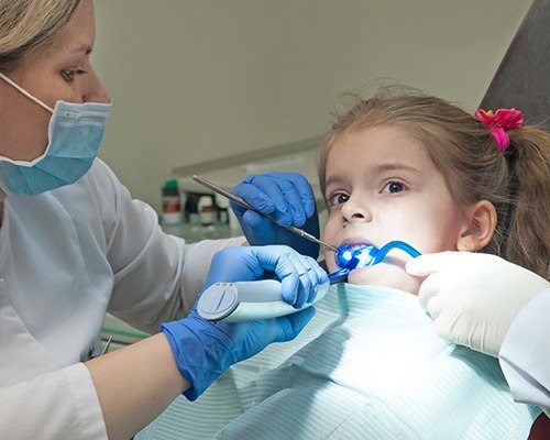 Child receiving dental sealants