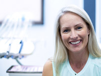 smiling older woman in dental office