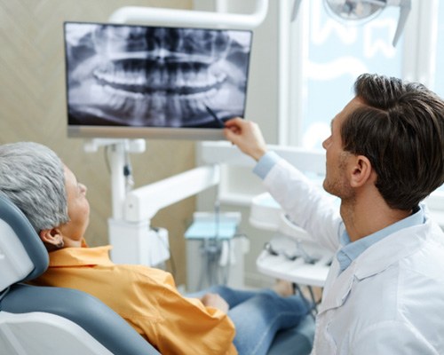 a dentist consulting with a patient