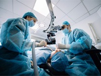 an oral surgeon placing a dental implant