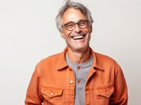 a smiling man with glasses