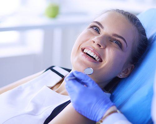 Smiling woman in dental chair