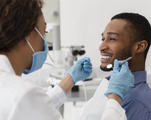 man talking to his dentist 