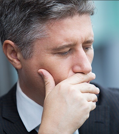 Man covering his mouth