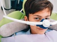 a child receiving nitrous oxide sedation at the dental office