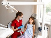 CNervous little girl at dentist’s office
