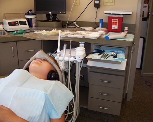 Child in dental chair with nitrous oxide mask