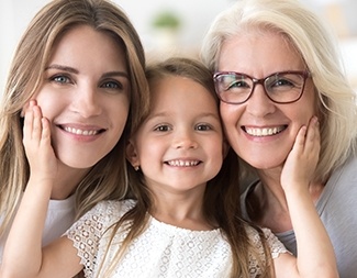 Three generations of women smiling together