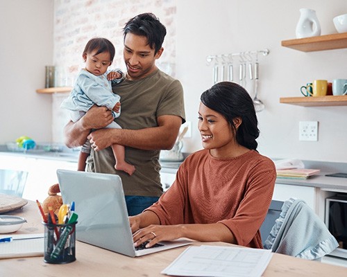 parents researching children’s dentistry on a laptop