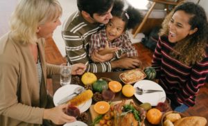 family of four enjoying a Thanksgiving meal 