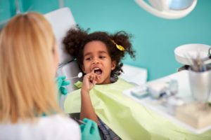 girl visits children’s dentist in Center