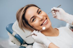 woman talking to dentist in Center