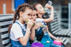 Schoolchildren eating lunches recommended by Center children's dentist