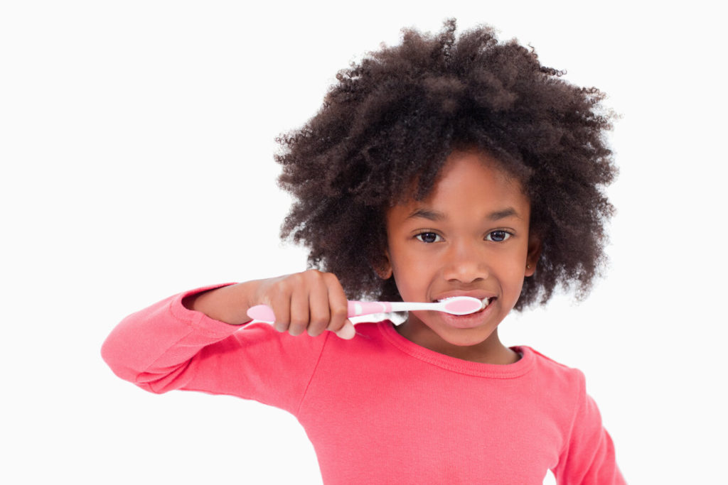 child brushing teeth during cold and flu season in Center