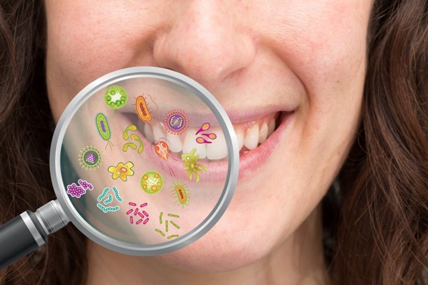 Oral bacteria underneath a magnifying glass.