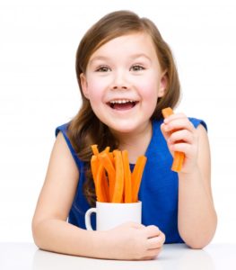 girl eating carrots