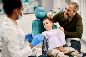Father with young son at dentist's office. 