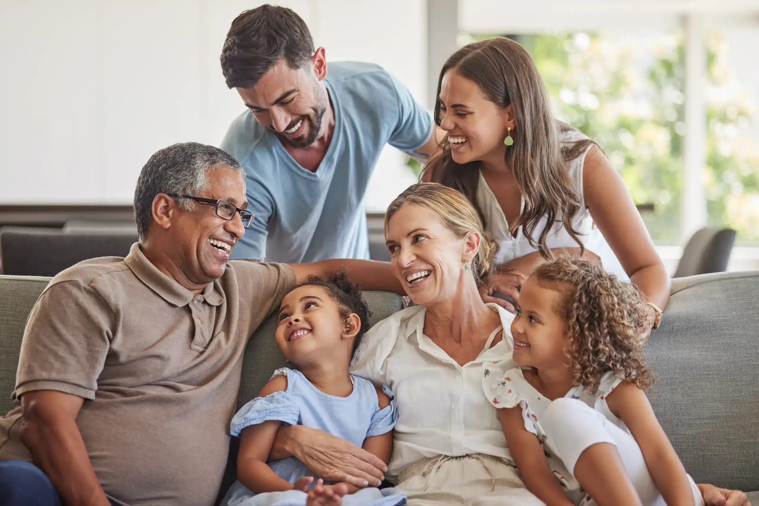 Multi generation family smiling together with healthy smiles for Sedation Dentistry in Center TX