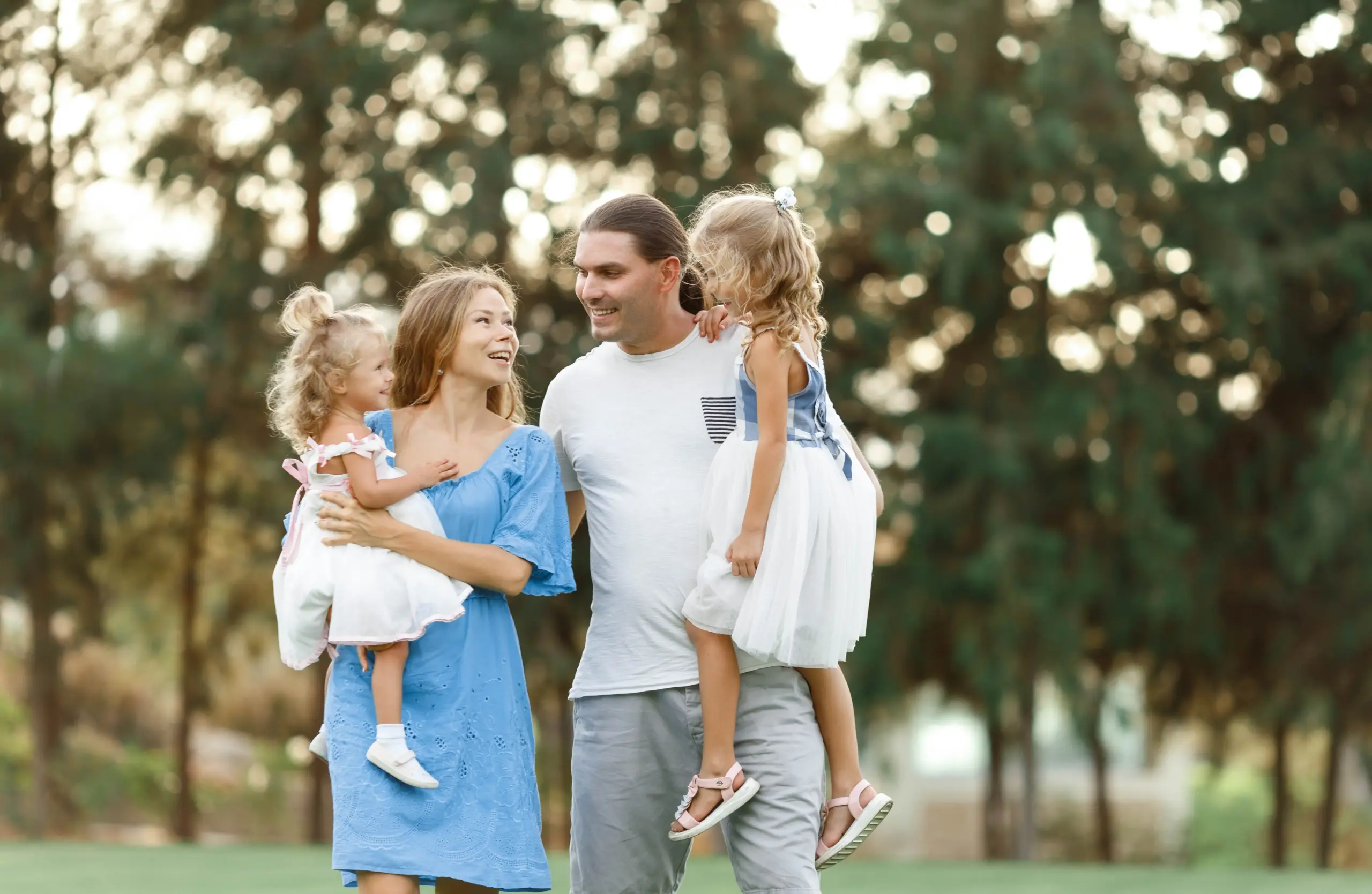 Family walking together smiling and enjoying healthy smiles in Center TX