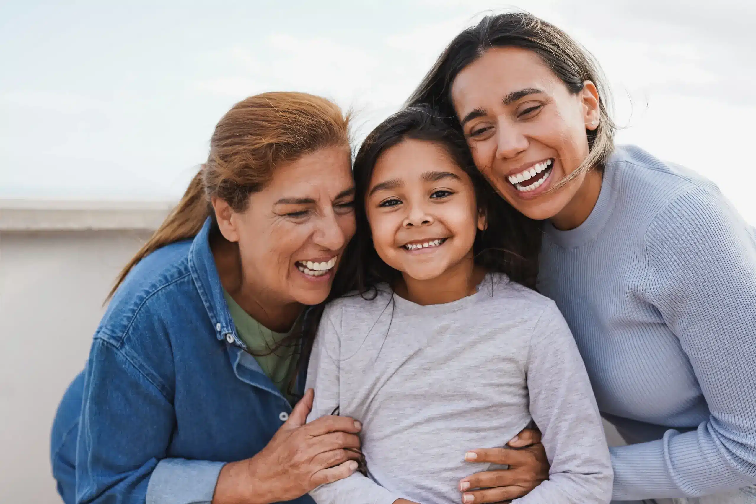 Happy family smiling together showing healthy smiles in Center TX