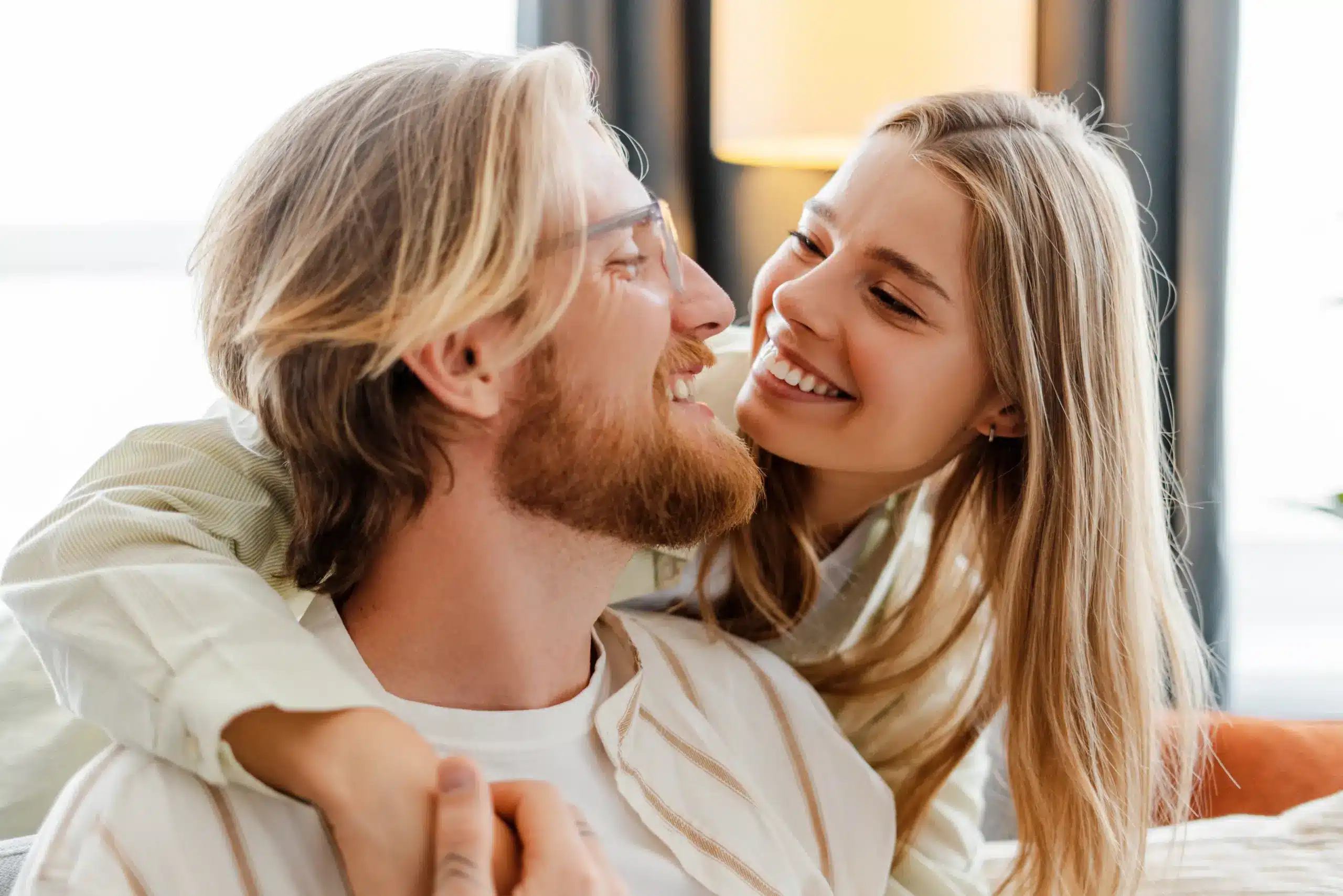 Happy couple smiling together with healthy teeth after Dental Crowns in Center TX