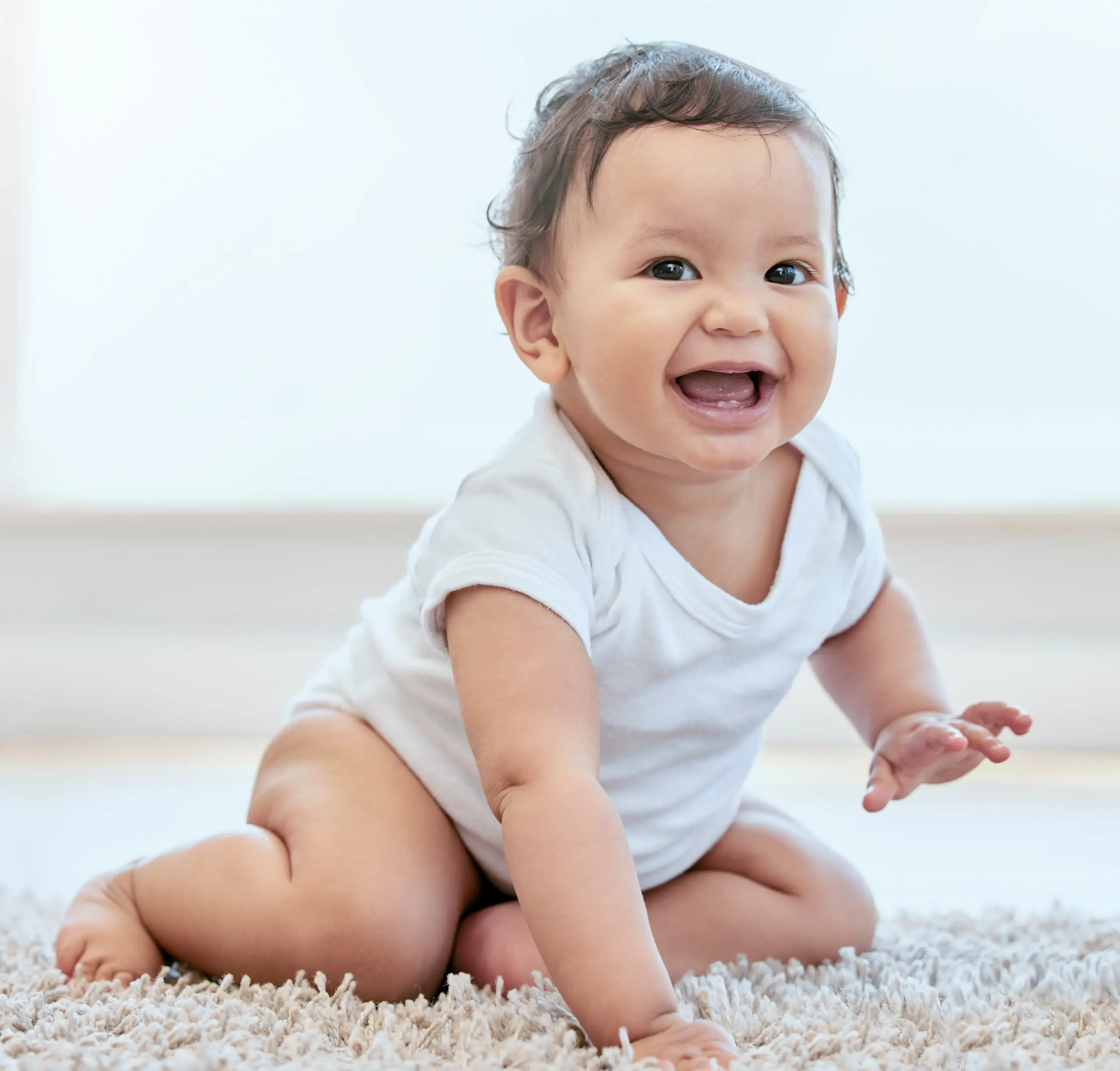 Smiling baby showing early healthy smile for pediatric dentistry in Center TX