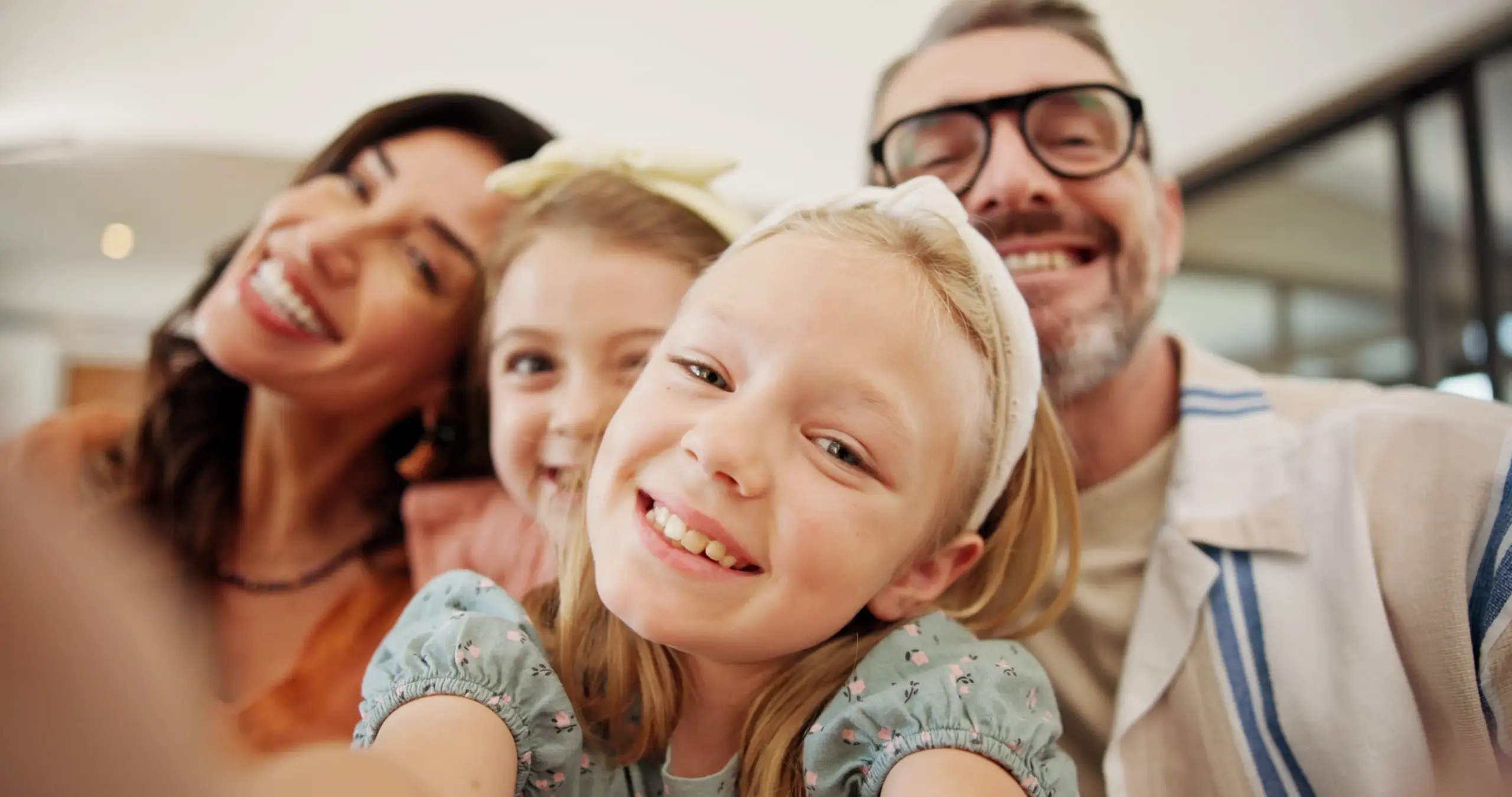 Family taking selfie with healthy smiles after Children's Dental Sealants and Flouride Treatment in Center TX