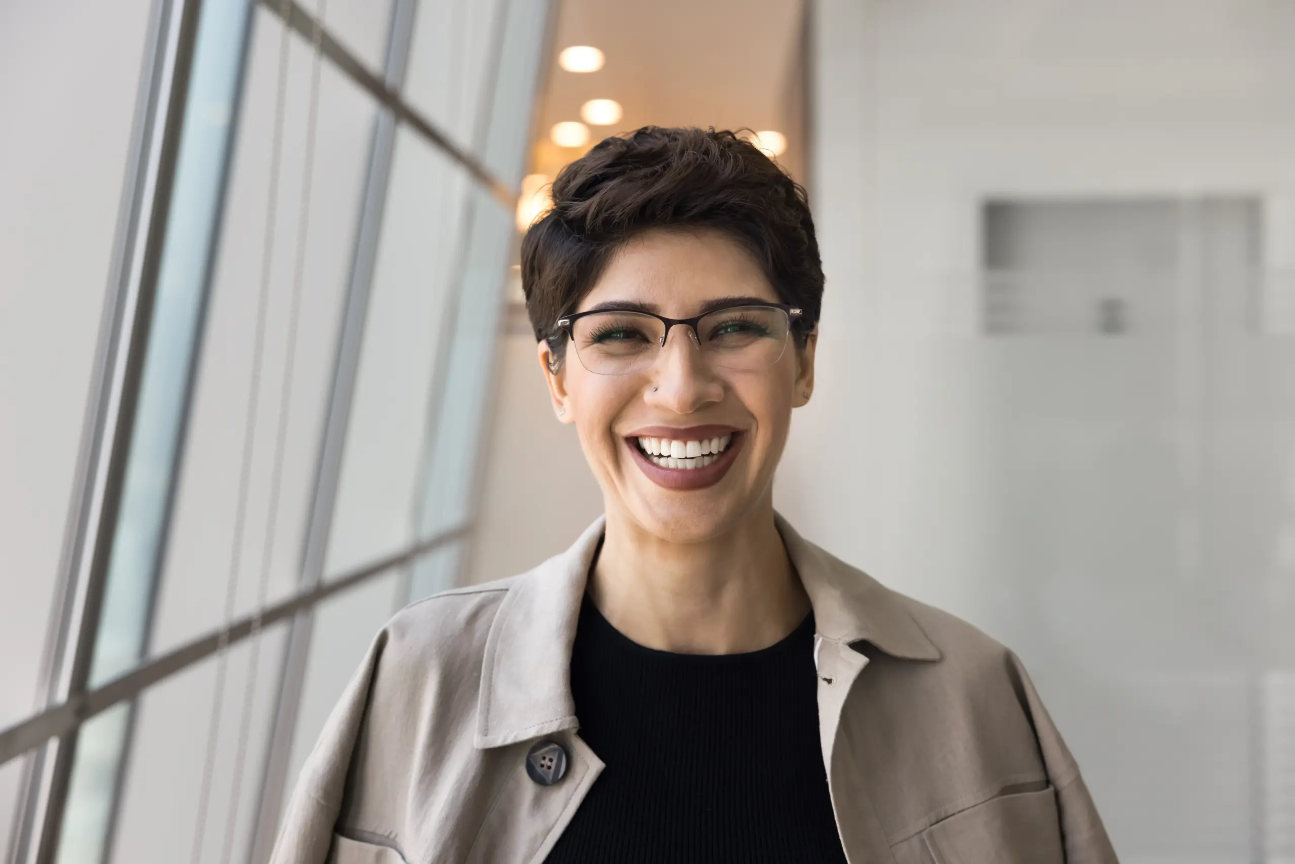 Smiling patient with Metal-Free Restorations at dental office in Center TX