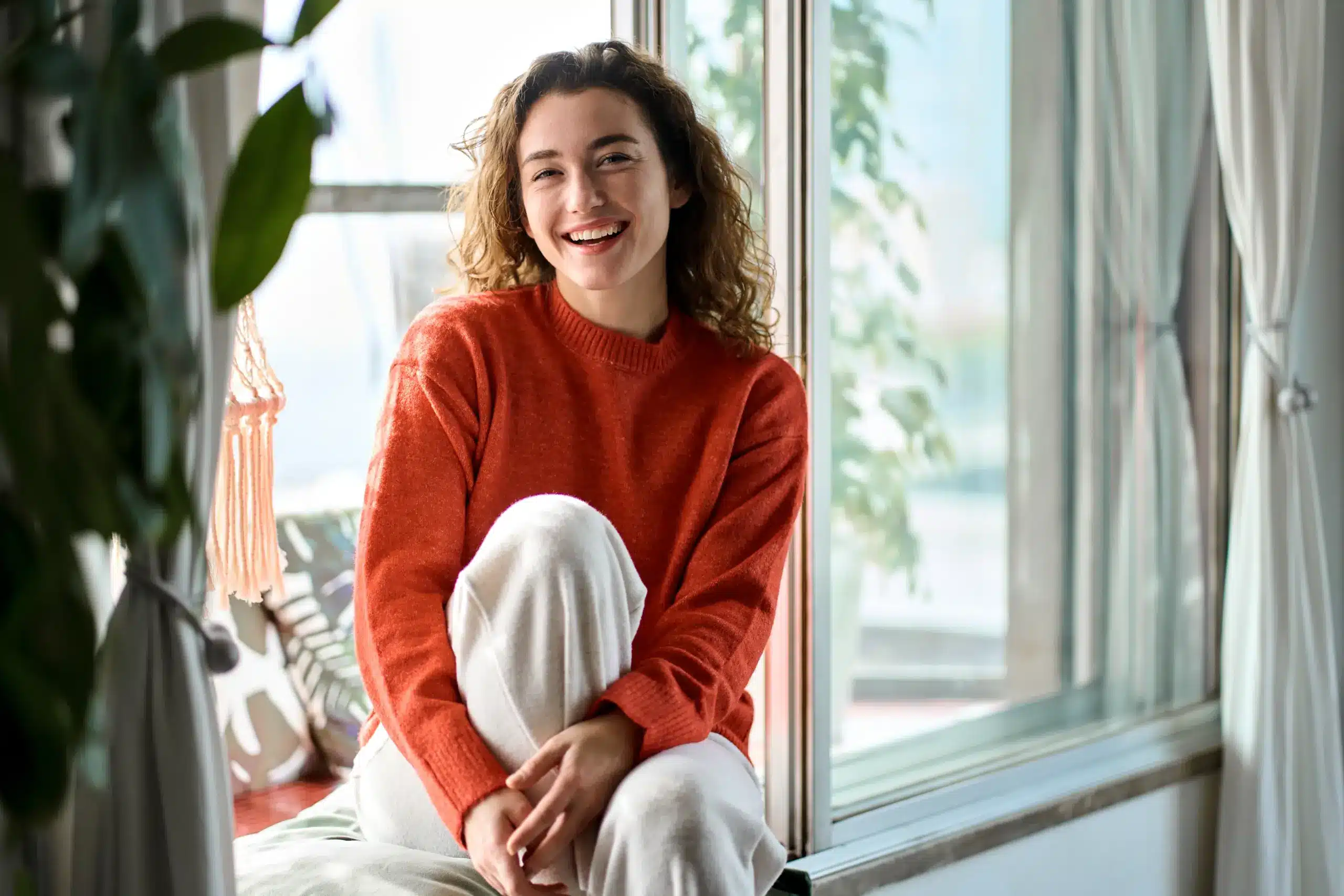 Young woman smiling with bright healthy smile because of Dental Bridges in Center TX