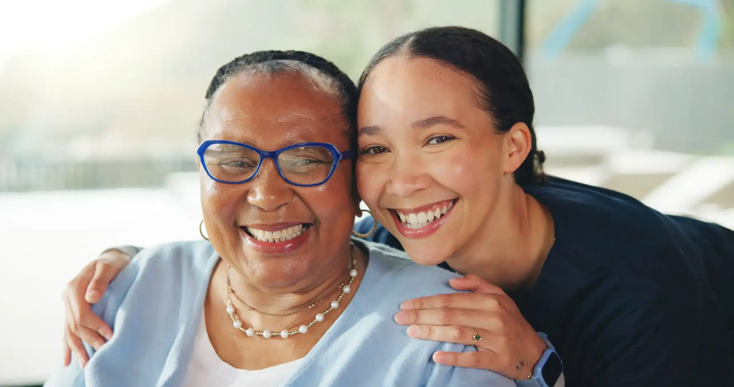 Mother and daughter smiling together with healthy Restorative Dentistry in Center TX