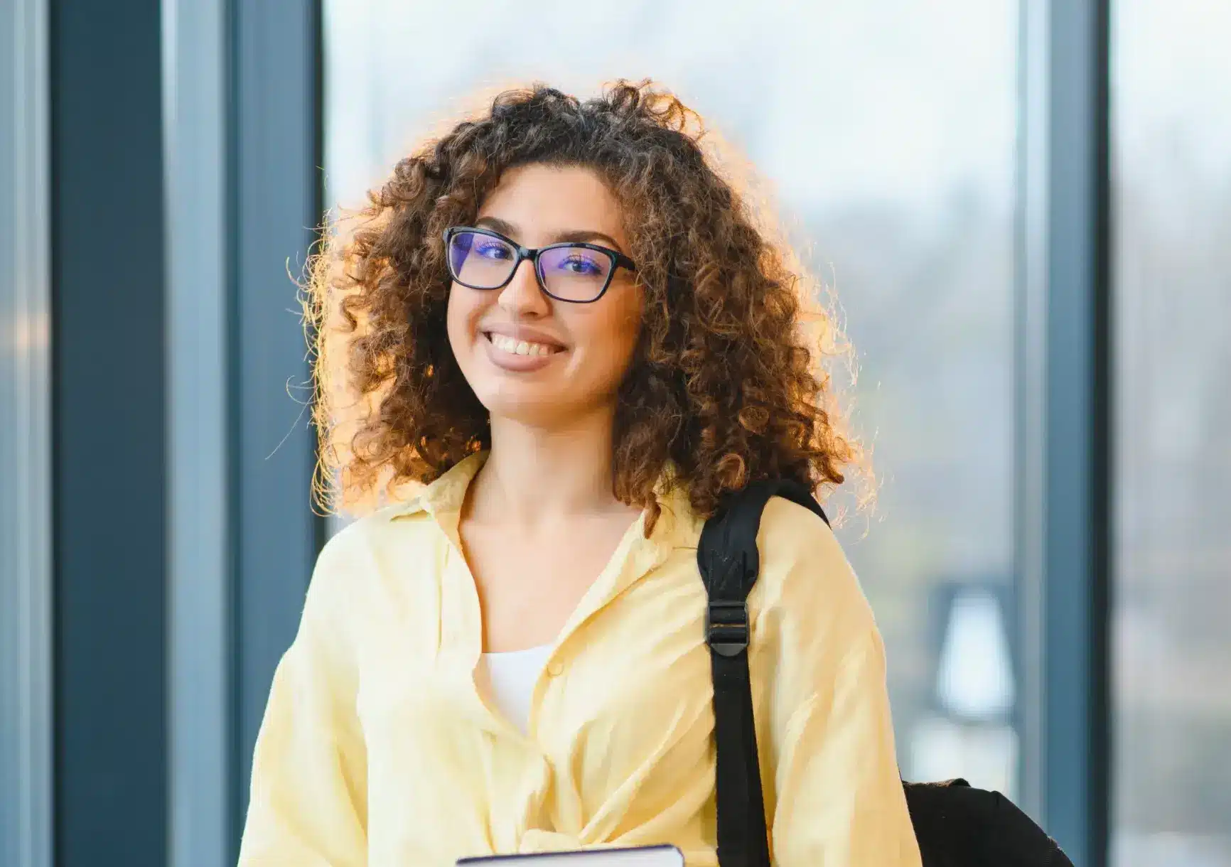 Young woman smiling confidently with bright teeth in Center TX