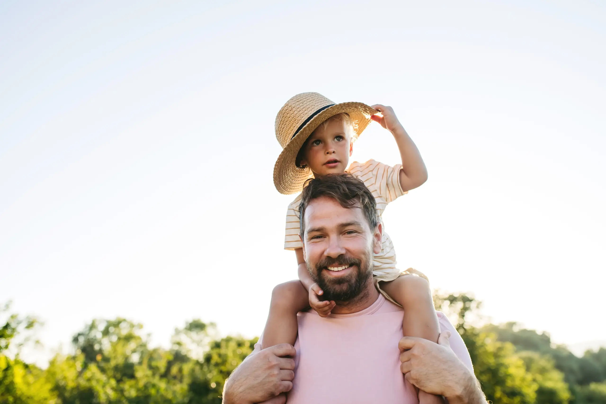 Children playing outdoors smiling with healthy teeth in Center TX